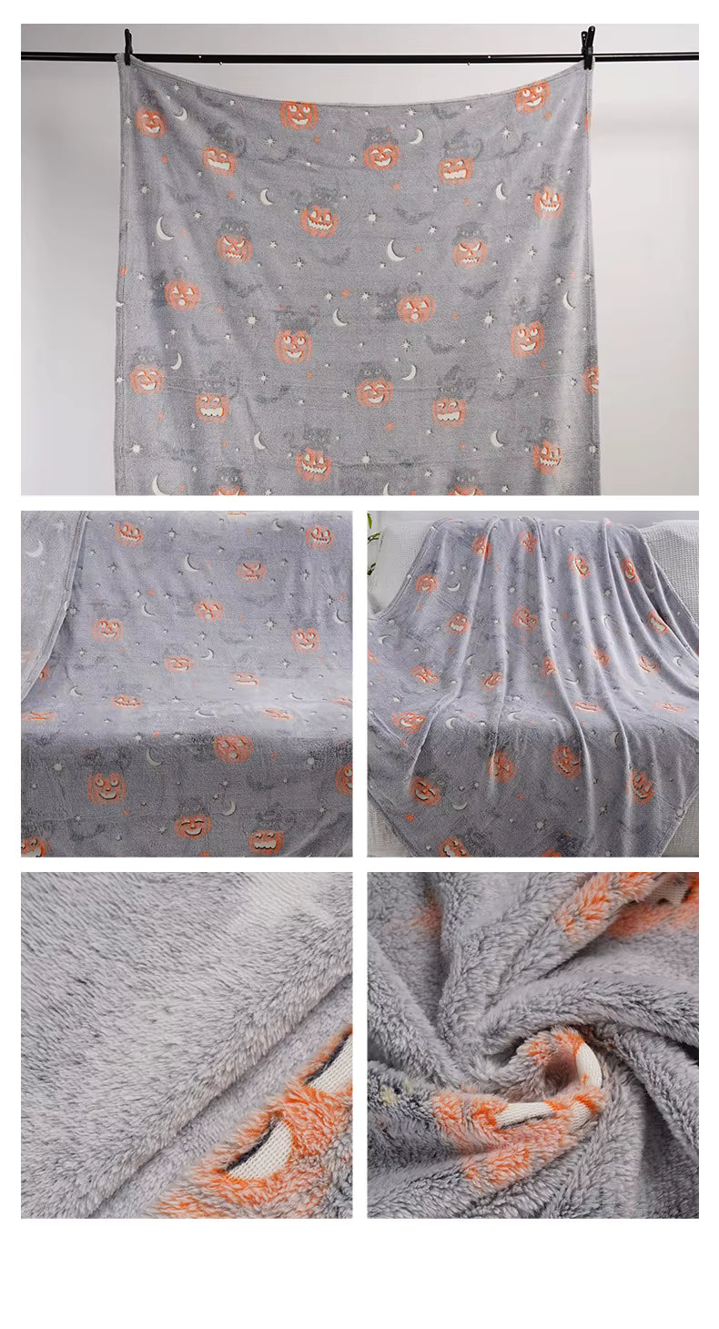 Full-size gray glow-in-the-dark Halloween blanket hanging to show entire pattern