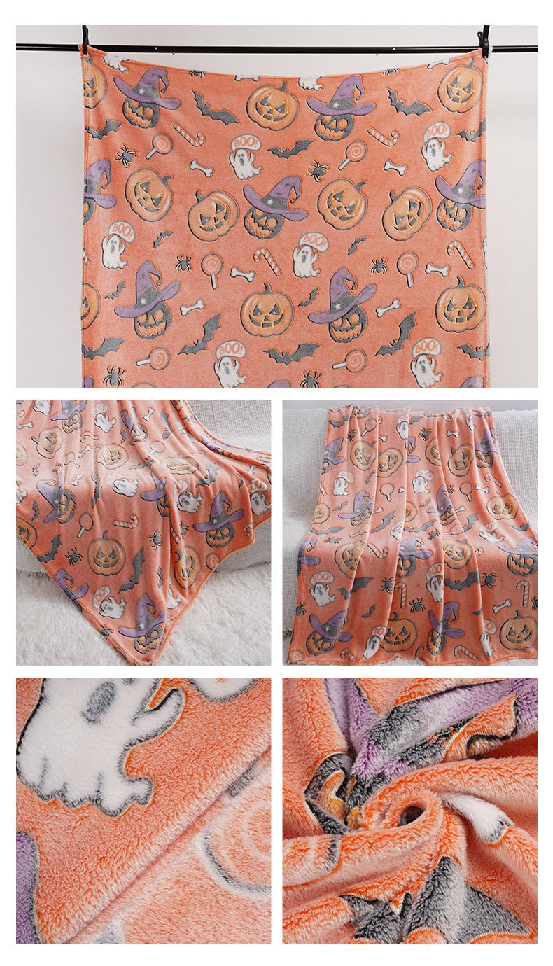 Full-size pink glow-in-the-dark Halloween blanket hanging to show entire pattern