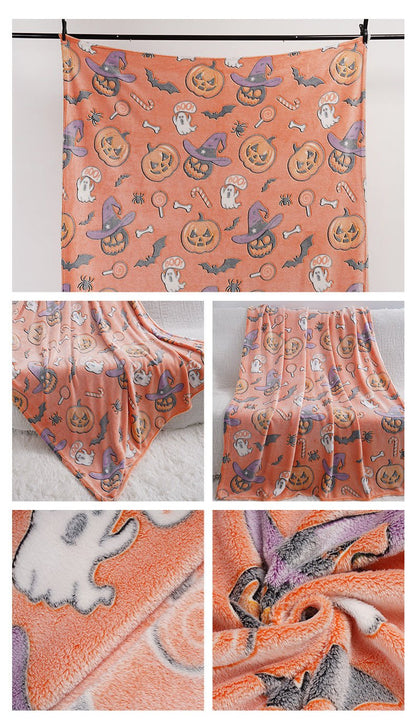 Full-size pink glow-in-the-dark Halloween blanket hanging to show entire pattern