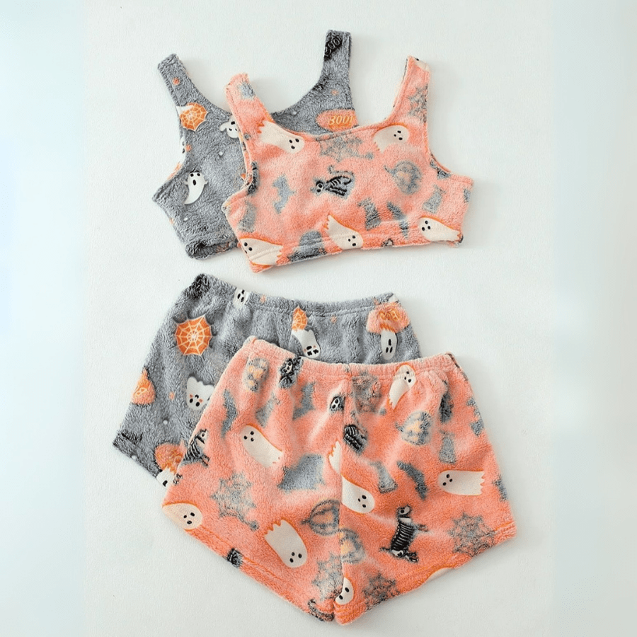 Flat lay of pink and grey sherpa pajama sets side by side on white background