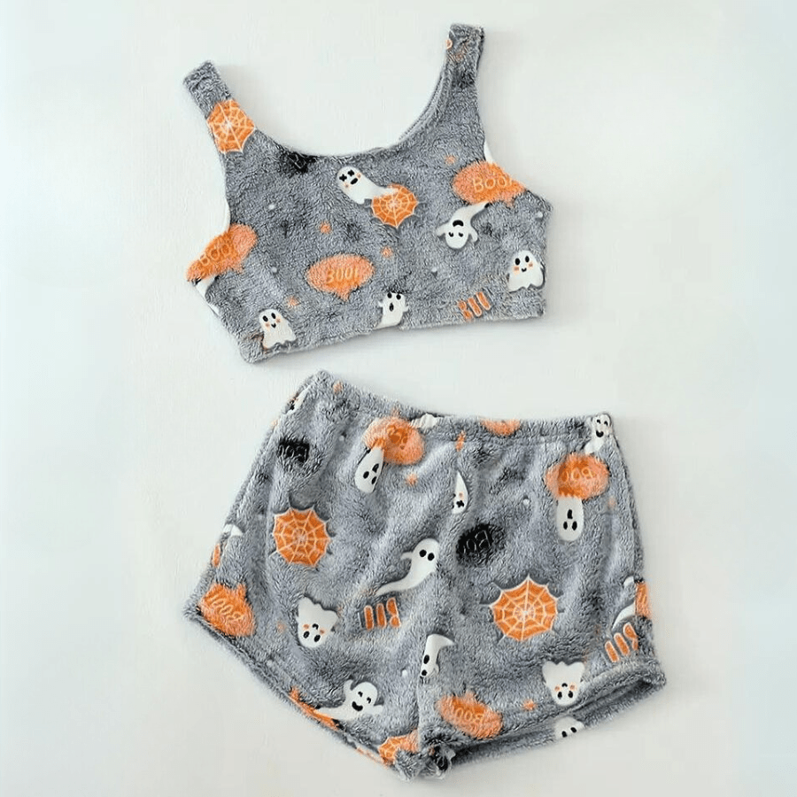 Flat lay of grey Halloween spider web print sherpa pajama set crop top and shorts on white background