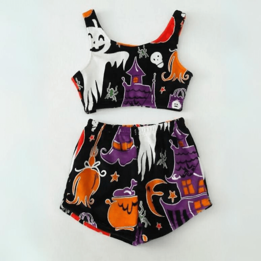 Flat lay of black and purple Halloween sherpa pajama set with pumpkin and ghost prints