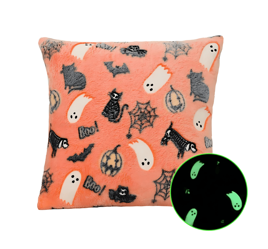 Decorative Pink Halloween pillow featuring ghost, spiderweb, and bat glow motifs
